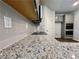 Modern kitchen features granite countertops, gray tile backsplash, and sleek black cooktop at 642 Egrets Landing #66, Covington, GA 30014