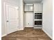 Contemporary kitchen with stainless steel double ovens and modern gray cabinetry at 642 Egrets Landing #66, Covington, GA 30014