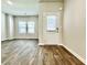 Spacious living area with a door to the backyard, and natural light from multiple windows at 642 Egrets Landing #66, Covington, GA 30014