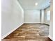 Bright living room with wood-look floors and neutral paint, perfect for relaxing and entertaining at 642 Egrets Landing #66, Covington, GA 30014