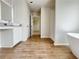Luxurious bathroom featuring wood-look tile flooring, soaking tub, and separate shower at 642 Egrets Landing #66, Covington, GA 30014