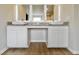 Bathroom with a modern vanity and vessel sinks under lighted mirrors at 642 Egrets Landing #66, Covington, GA 30014
