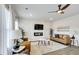 Well-lit living room with modern fireplace and open floor plan at 642 Egrets Landing #66, Covington, GA 30014