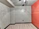 Finished basement with a creative accent wall, a ceiling fan and carpeted floors at 1229 Woodmere Dr, Loganville, GA 30052