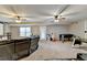Large recreational room in finished basement with game tables and a home theatre arrangement at 1229 Woodmere Dr, Loganville, GA 30052