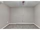 Finished basement with neutral walls, carpet, a ceiling fan and access to electrical outlets at 1229 Woodmere Dr, Loganville, GA 30052