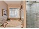 Relaxing bathroom with a soaking tub and separate glass-enclosed shower, a private retreat at 1229 Woodmere Dr, Loganville, GA 30052
