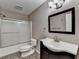 Bathroom with shower-tub combo, decorative vanity, and modern fixtures at 1229 Woodmere Dr, Loganville, GA 30052