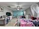 Bedroom featuring twin beds, neutral carpet, and large windows with views of outside at 1229 Woodmere Dr, Loganville, GA 30052