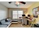 Bedroom features a work space, soft carpet, and natural light at 1229 Woodmere Dr, Loganville, GA 30052