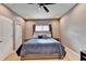 Bedroom featuring a comfortable bed, ceiling fan, and neutral-colored walls at 1229 Woodmere Dr, Loganville, GA 30052
