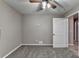 Neutral bedroom featuring soft carpet, ceiling fan, and neutral walls at 1229 Woodmere Dr, Loganville, GA 30052