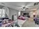 Bright bedroom with two beds, a ceiling fan, and plenty of space for activities at 1229 Woodmere Dr, Loganville, GA 30052