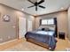 Cozy bedroom with a comfortable bed, neutral colors, and a ceiling fan at 1229 Woodmere Dr, Loganville, GA 30052