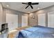 Bedroom with a comfortable bed, ceiling fan, and neutral-colored walls at 1229 Woodmere Dr, Loganville, GA 30052