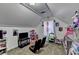 Bonus room with carpeted flooring, a window, shelving, and decor at 1229 Woodmere Dr, Loganville, GA 30052
