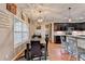 Dining area open to kitchen with granite counters and stainless steel appliances at 1229 Woodmere Dr, Loganville, GA 30052