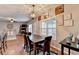 View of the dining area that connects seamlessly with the living room and fireplace at 1229 Woodmere Dr, Loganville, GA 30052