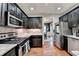 Well-equipped kitchen with stainless steel appliances and granite countertops at 1229 Woodmere Dr, Loganville, GA 30052