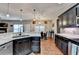 Kitchen with modern appliances and access to dining area at 1229 Woodmere Dr, Loganville, GA 30052