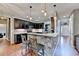 Cozy kitchen featuring a stylish breakfast bar and pendant lighting at 1229 Woodmere Dr, Loganville, GA 30052
