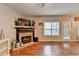 Bright living room featuring a stone fireplace and access to the outdoor space at 1229 Woodmere Dr, Loganville, GA 30052