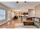 Open concept living space with natural light, hardwood floors and comfortable seating at 1229 Woodmere Dr, Loganville, GA 30052