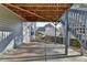 Under-deck patio with stairs leading up, offering a sheltered outdoor space at 1229 Woodmere Dr, Loganville, GA 30052