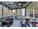 Cozy covered patio with stylish furniture, creating an inviting outdoor living space at 1229 Woodmere Dr, Loganville, GA 30052