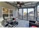 Charming patio with comfortable seating and a ceiling fan for warm days at 1229 Woodmere Dr, Loganville, GA 30052