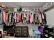 Organized walk-in closet with ample shelving and storage solutions for clothes and shoes at 1229 Woodmere Dr, Loganville, GA 30052