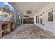 Covered patio with stone flooring and steps to a backyard with a grill, perfect for entertaining and relaxation at 2456 Manor Walk, Decatur, GA 30030