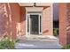 The inviting black front door is framed by sidelights and brick columns at 2456 Manor Walk, Decatur, GA 30030