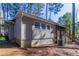 Back of house showing yard and screen porch, offering privacy and relaxation at 2777 Luther Dr, Atlanta, GA 30344