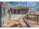 Enclosed back porch leading to a wood deck, perfect for outdoor enjoyment at 2777 Luther Dr, Atlanta, GA 30344