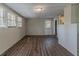 Unfinished basement area with wood-look flooring and bright natural light from several windows at 2777 Luther Dr, Atlanta, GA 30344