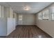 Unfinished basement area featuring wood-look flooring and natural light from multiple windows at 2777 Luther Dr, Atlanta, GA 30344