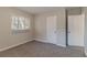 Neutral-walled bedroom with carpet, a window, a closet, and ample sunlight at 2777 Luther Dr, Atlanta, GA 30344