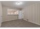 Bedroom with wall paneling, carpet, and natural light from the window at 2777 Luther Dr, Atlanta, GA 30344