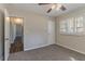 Carpeted bedroom with neutral walls, a window, and access to the hallway at 2777 Luther Dr, Atlanta, GA 30344