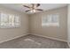 Bright bedroom with a ceiling fan, carpet, windows and neutral-colored walls at 2777 Luther Dr, Atlanta, GA 30344