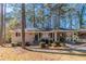 Charming brick ranch-style home with a covered carport and well-maintained landscaping at 2777 Luther Dr, Atlanta, GA 30344