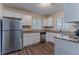 Updated kitchen featuring white cabinets, granite countertops, and stainless steel appliances at 2777 Luther Dr, Atlanta, GA 30344