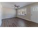 Bright living room with wood-look floors, neutral walls, ceiling fan and natural light at 2777 Luther Dr, Atlanta, GA 30344