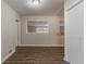 Neutral-toned room with wood floors, showing a seamless transition to other areas at 2777 Luther Dr, Atlanta, GA 30344
