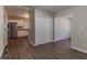 View from room featuring wood floors, looking into the kitchen with stainless steel refrigerator at 2777 Luther Dr, Atlanta, GA 30344