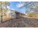 Backyard features a brick exterior and a concrete patio with lots of potential for a serene outdoor space at 3884 Rockey Valley Dr, Conley, GA 30288