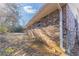 Backyard view shows brick exterior of home and concrete patio, a blank canvas at 3884 Rockey Valley Dr, Conley, GA 30288