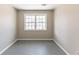 Neutral bedroom featuring bright window and neutral paint at 3884 Rockey Valley Dr, Conley, GA 30288