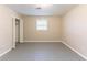 Neutral bedroom featuring closet, window, and neutral paint at 3884 Rockey Valley Dr, Conley, GA 30288